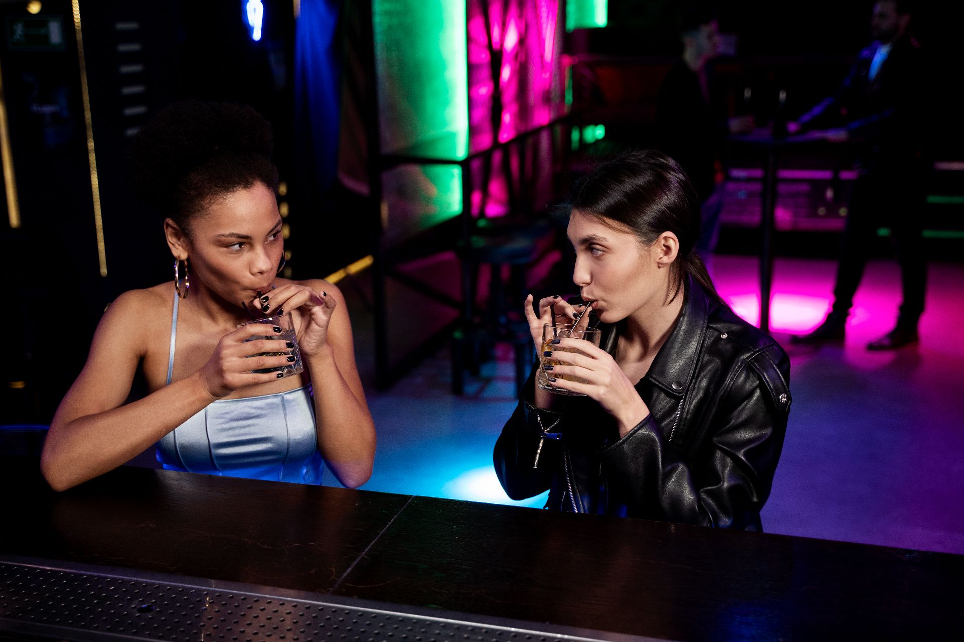 medium-shot-women-with-drinks-bar.jpg